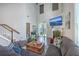 Bright living room with hardwood floors, fireplace, and large windows at 1666 Bridwell Ln, Mount Pleasant, SC 29466