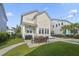Landscaped backyard featuring a pool, patio, outdoor seating, and ample lawn space at 1713 Banning St, Mount Pleasant, SC 29466