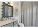 Stylish bathroom with a decorative mirror, neutral colors, and elegant fixtures at 1713 Banning St, Mount Pleasant, SC 29466