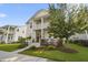 Charming two-story home featuring a welcoming porch, balcony, and beautifully landscaped front yard at 1713 Banning St, Mount Pleasant, SC 29466