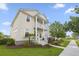 Charming two-story home featuring a welcoming porch, balcony, and beautifully landscaped front yard at 1713 Banning St, Mount Pleasant, SC 29466