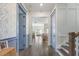 Inviting hallway features elegant decor, beautiful wainscoting, and seamless transition to the living spaces at 1713 Banning St, Mount Pleasant, SC 29466