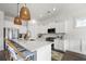 Modern kitchen featuring white cabinets, stainless steel appliances, and a spacious island with seating at 1713 Banning St, Mount Pleasant, SC 29466