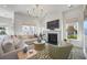 Cozy living room with a fireplace, comfortable seating, and abundant natural light at 1713 Banning St, Mount Pleasant, SC 29466