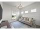 Bright living room featuring a plush sofa, stylish lighting, and large windows at 1713 Banning St, Mount Pleasant, SC 29466