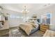 Comfortable main bedroom with soft lighting, a decorative chandelier, and a serene ambiance at 1713 Banning St, Mount Pleasant, SC 29466