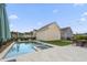 Sparkling backyard pool and spa surrounded by lush landscaping and stylish amenities at 1713 Banning St, Mount Pleasant, SC 29466