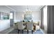Formal dining room showcases elegant chandelier, wainscoting, and sophisticated decor for memorable gatherings at 1751 Cultivation Lane Dr # 498, Mount Pleasant, SC 29466