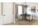A cozy dining room features a round table, comfortable seating and neutral decor, creating an inviting atmosphere at 1751 Cultivation Lane Dr # 498, Mount Pleasant, SC 29466