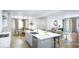 Open-concept kitchen featuring a large island, modern appliances, and seamless flow into the living spaces at 1751 Cultivation Lane Dr # 498, Mount Pleasant, SC 29466