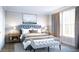 Serene main bedroom with soft lighting, luxurious bedding, and elegant curtains, creating a restful retreat at 1751 Cultivation Lane Dr # 498, Mount Pleasant, SC 29466