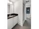 Bright bathroom with a modern vanity, sink, and a shower with a white curtain at 1878 Headquarters Plantation Dr, Johns Island, SC 29455