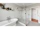 Updated bathroom with a clawfoot tub, glass-enclosed shower, and hexagon and square tile floors at 1878 Headquarters Plantation Dr, Johns Island, SC 29455