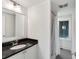 Bright bathroom with a modern vanity, a sink, and a walk-in shower with a white curtain at 1878 Headquarters Plantation Dr, Johns Island, SC 29455