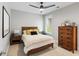 Cozy bedroom with rustic wood furniture, ceiling fan and natural light at 1878 Headquarters Plantation Dr, Johns Island, SC 29455