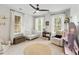 Bright Bedroom featuring large windows, a ceiling fan, and ample space for a crib, glider, and toy storage at 1878 Headquarters Plantation Dr, Johns Island, SC 29455