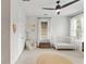 Bright Bedroom featuring large windows, a ceiling fan, and ample space for a crib, glider, and toy storage at 1878 Headquarters Plantation Dr, Johns Island, SC 29455