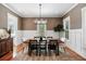 Modern dining room features stylish lighting, neutral decor, and ample space for hosting memorable meals at 1878 Headquarters Plantation Dr, Johns Island, SC 29455