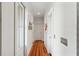 Bright hallway with hardwood floors, neutral walls and natural light at 1878 Headquarters Plantation Dr, Johns Island, SC 29455