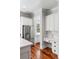 Clean kitchen with stainless steel refrigerator, white cabinetry, and hardwood floors at 1878 Headquarters Plantation Dr, Johns Island, SC 29455