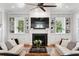 Cozy living room with custom built-ins, fireplace, and comfortable seating at 1878 Headquarters Plantation Dr, Johns Island, SC 29455