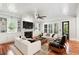 Cozy living room features a fireplace, built-in shelving, hardwood floors, and lots of natural light at 1878 Headquarters Plantation Dr, Johns Island, SC 29455