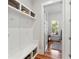Organized mudroom with built-in storage, bench and stylish decor at 1878 Headquarters Plantation Dr, Johns Island, SC 29455