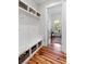 Bright mudroom with built-in storage and view into playroom at 1878 Headquarters Plantation Dr, Johns Island, SC 29455
