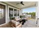 Relaxing outdoor porch featuring stylish seating and picturesque views of the surrounding neighborhood at 1878 Headquarters Plantation Dr, Johns Island, SC 29455