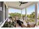 Inviting covered porch with stylish furniture and scenic views for relaxing and entertaining at 1878 Headquarters Plantation Dr, Johns Island, SC 29455