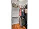 Spacious closet with hardwood floors, custom shelving and rods for organized clothing and accessory storage at 1878 Headquarters Plantation Dr, Johns Island, SC 29455