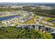 Aerial view of a residential community with ponds, walking trails, and a community pool at 202 Buttercup Ln, Summerville, SC 29486