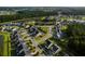 Aerial view of the property showcasing its location within a community with ponds and an amenities center at 202 Buttercup Ln, Summerville, SC 29486