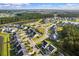 Aerial view of a well-planned residential community with lush landscaping and multiple ponds at 202 Buttercup Ln, Summerville, SC 29486