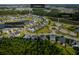 Aerial view of the property showcasing its location within a community with ponds and an amenities center at 202 Buttercup Ln, Summerville, SC 29486