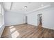 Spacious bedroom featuring hardwood floors, tray ceilings, and an ensuite bathroom at 202 Buttercup Ln, Summerville, SC 29486