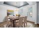Staged dining room featuring a wooden table with six chairs and buffet at 202 Buttercup Ln, Summerville, SC 29486