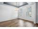 Spacious dining room with modern lighting and abundant natural light at 202 Buttercup Ln, Summerville, SC 29486