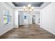 Dining room with hardwood flooring, modern light fixture and plenty of sunlight at 202 Buttercup Ln, Summerville, SC 29486