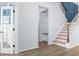 Bright entryway with wood floors, open staircase, and decorative accent wall at 202 Buttercup Ln, Summerville, SC 29486