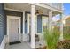 Welcoming covered front porch with a ceiling fan and cozy seating at 202 Buttercup Ln, Summerville, SC 29486