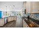 Spacious kitchen boasts stainless appliances, granite counters and hardwood floors at 202 Buttercup Ln, Summerville, SC 29486