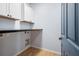 Bright laundry room with countertop, storage and tile flooring at 202 Buttercup Ln, Summerville, SC 29486