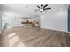 Spacious living room featuring recessed lights, kitchen access, and a stylish ceiling fan at 202 Buttercup Ln, Summerville, SC 29486