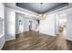 Open concept living room with modern lighting, abundant natural light and wood-look floors at 202 Buttercup Ln, Summerville, SC 29486