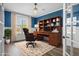 Staged office featuring a wooden desk and a brown leather chair at 202 Buttercup Ln, Summerville, SC 29486
