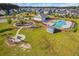 Community playground, pool, and fire pit area in a neighborhood with lush green space at 202 Buttercup Ln, Summerville, SC 29486