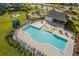 Community pool area with lounge chairs, splash pad, and shaded seating in a well-maintained neighborhood at 202 Buttercup Ln, Summerville, SC 29486