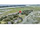 Beautiful aerial view of community featuring mature landscaping and waterfront access at 202 Mariners Cay Dr, Folly Beach, SC 29439