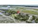 Scenic aerial view of the property nestled amongst trees and marshlands at 202 Mariners Cay Dr, Folly Beach, SC 29439